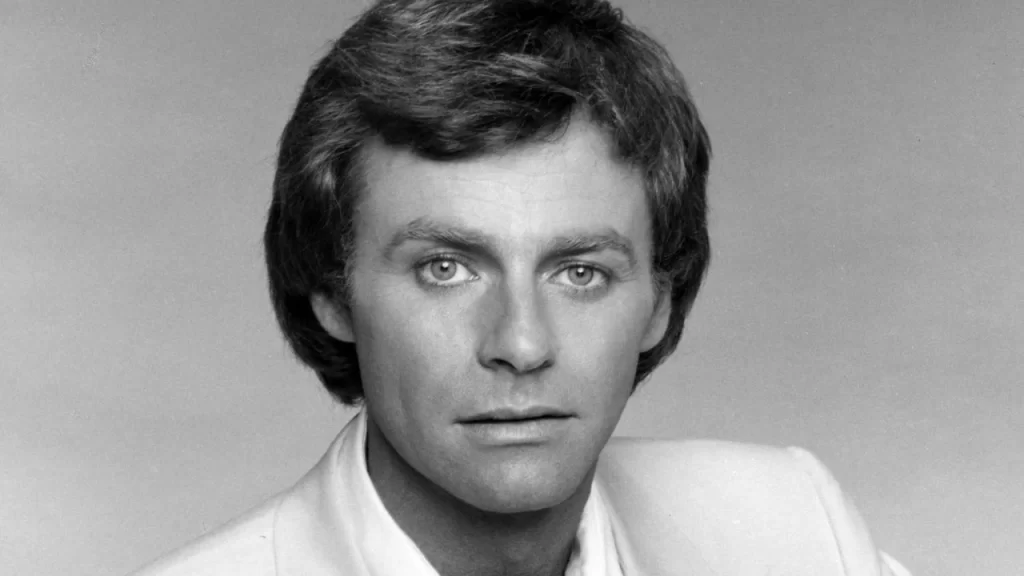 Tristan Rogers smiling in a professional press headshot portrait.