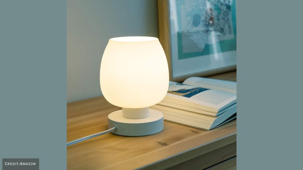 Touch bedside table lamp available at discounted price, ideal for bedroom or office use.