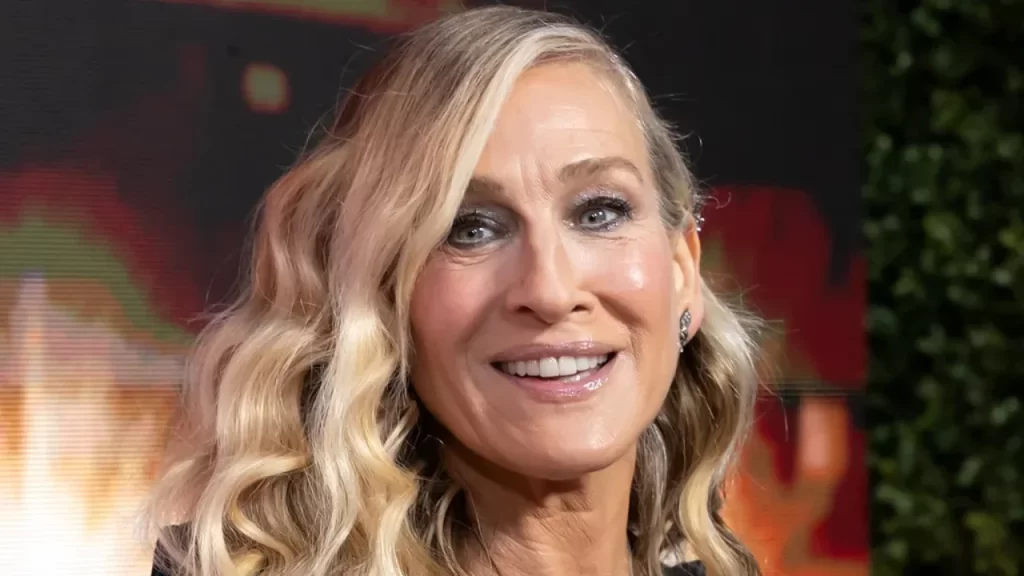 Authentic, joyful moment of Sarah Jessica Parker captured during a show-related video.