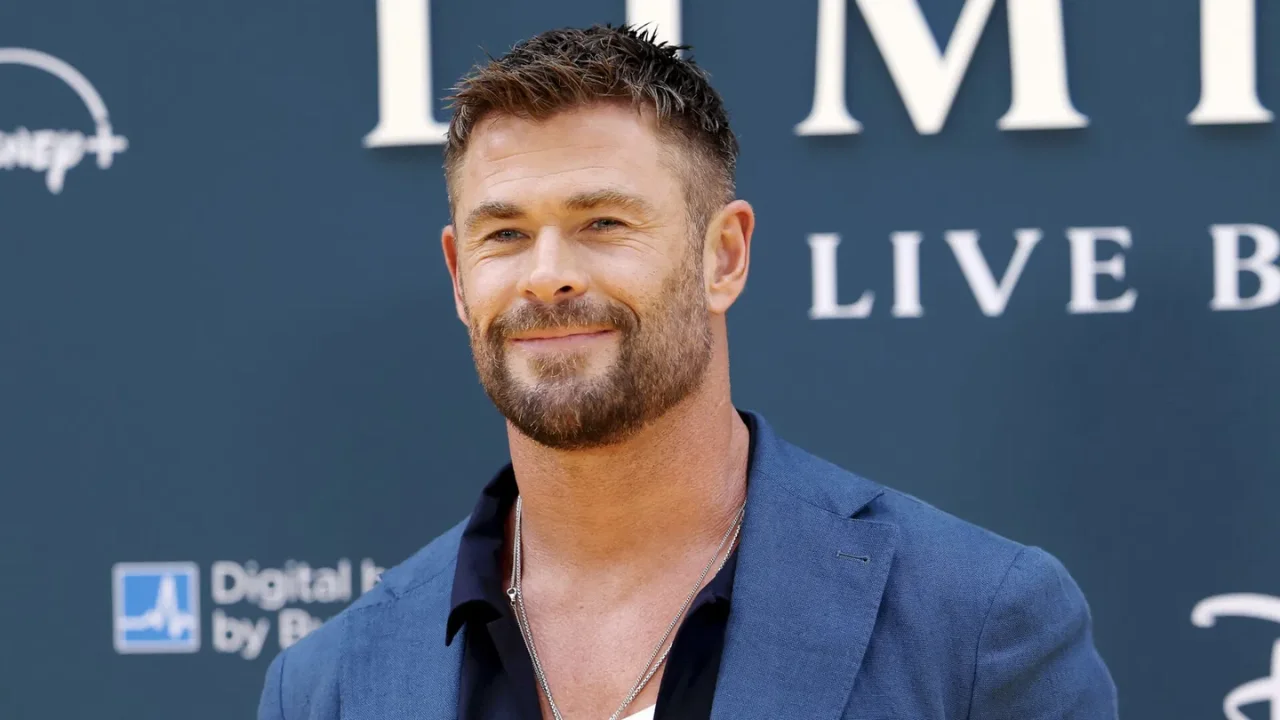 Chris Hemsworth attending the Limitless: Live Better Now premiere, looking contemplative and poised.