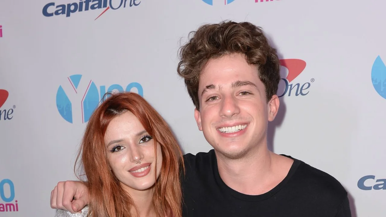 Close-up image of Bella Thorne and Charlie Puth smiling together during an appearance tied to widespread romance rumors.