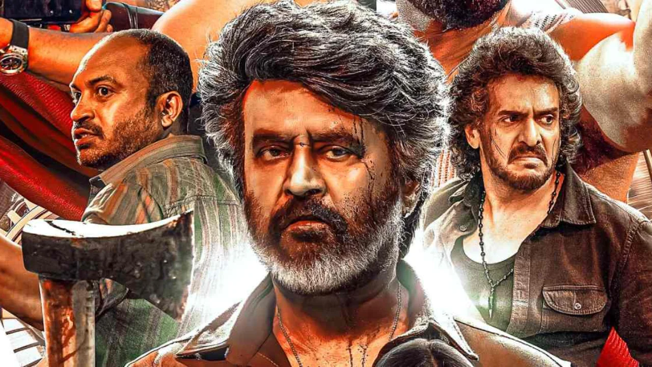 Close-up of Rajinikanth in rugged attire as Deva from Coolie (2025), holding a hammer with a fierce expression.