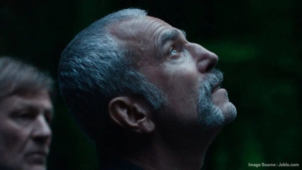 Daniel Day-Lewis looking upward in Anemone, symbolizing reflection and family struggles.