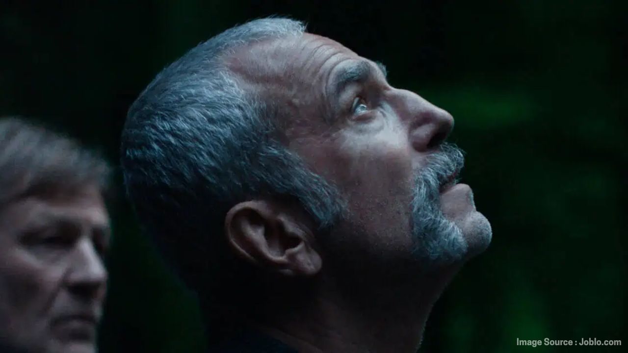 Daniel Day-Lewis looking upward in Anemone, symbolizing reflection and family struggles.