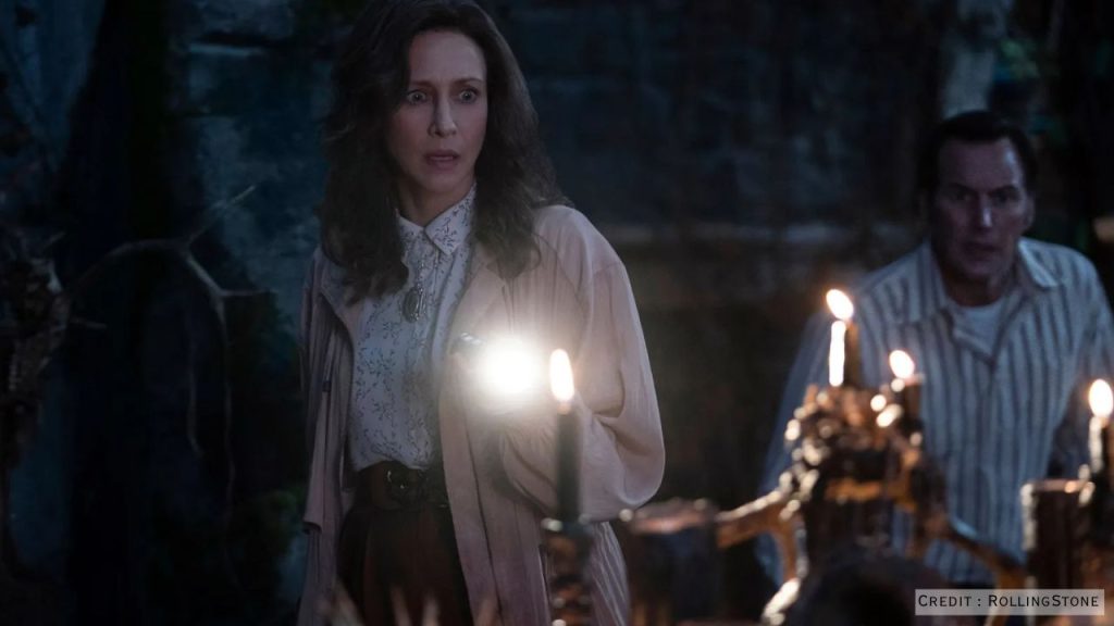 Patrick Wilson and Vera Farmiga as Ed and Lorraine Warren, shown in a dim, tense moment — highlighting their enduring bond.