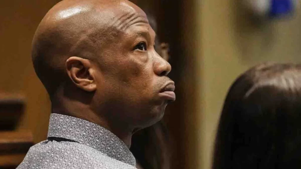 Hernandez Govan walks into court with his attorney during the Young Dolph murder trial.