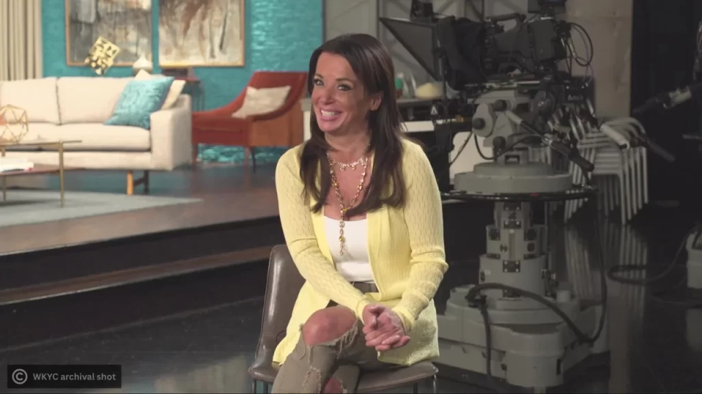 Hollie Strano in a studio setting, delivering weather forecasts and community updates on air