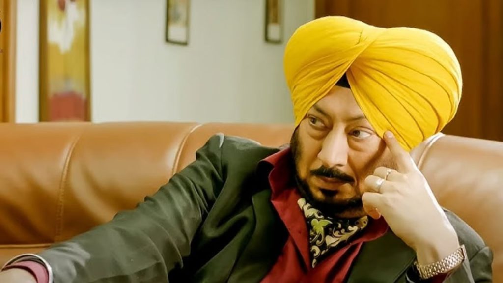 Veteran Punjabi comedian Jaswinder Bhalla in a candid moment wearing a yellow turban.