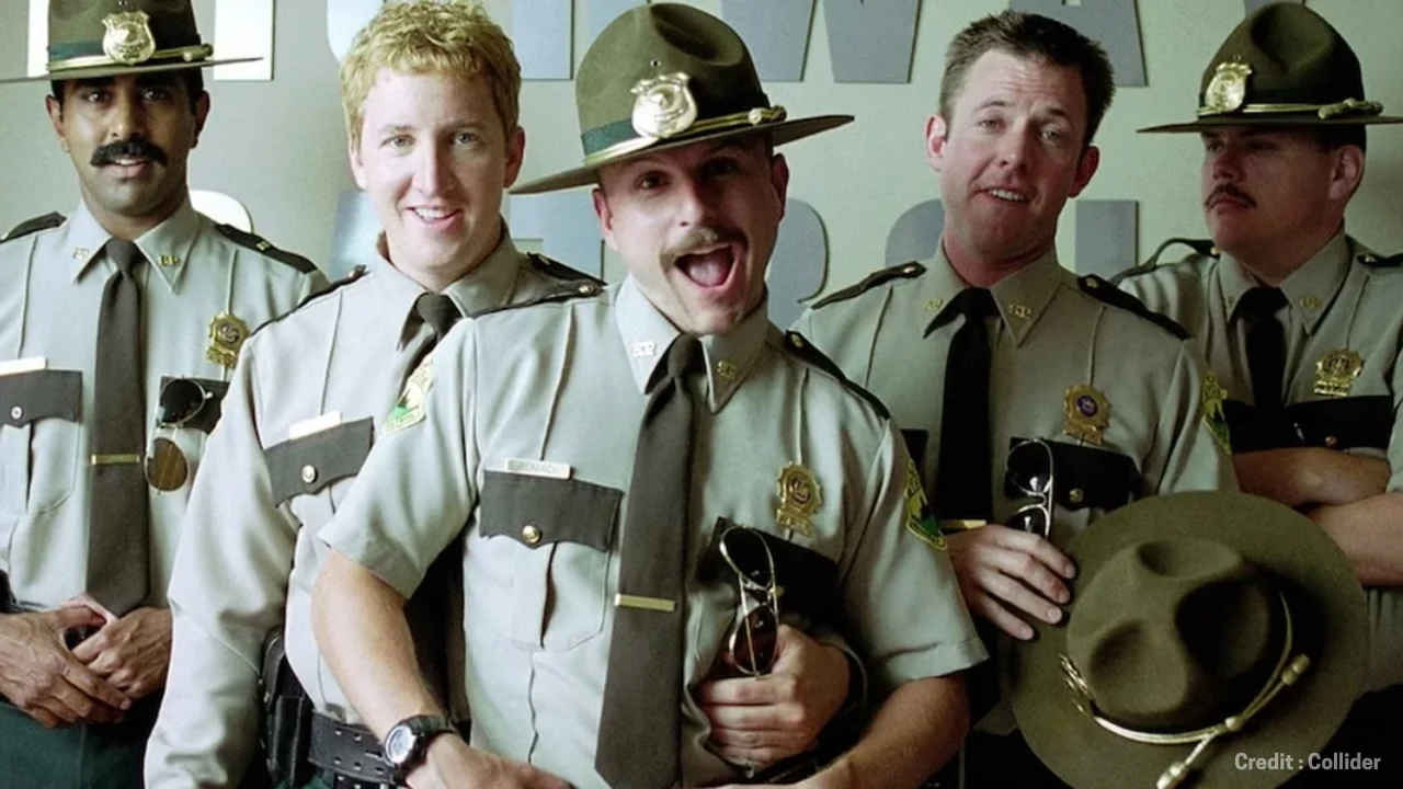 Original Super Troopers cast posing next to their patrol car
