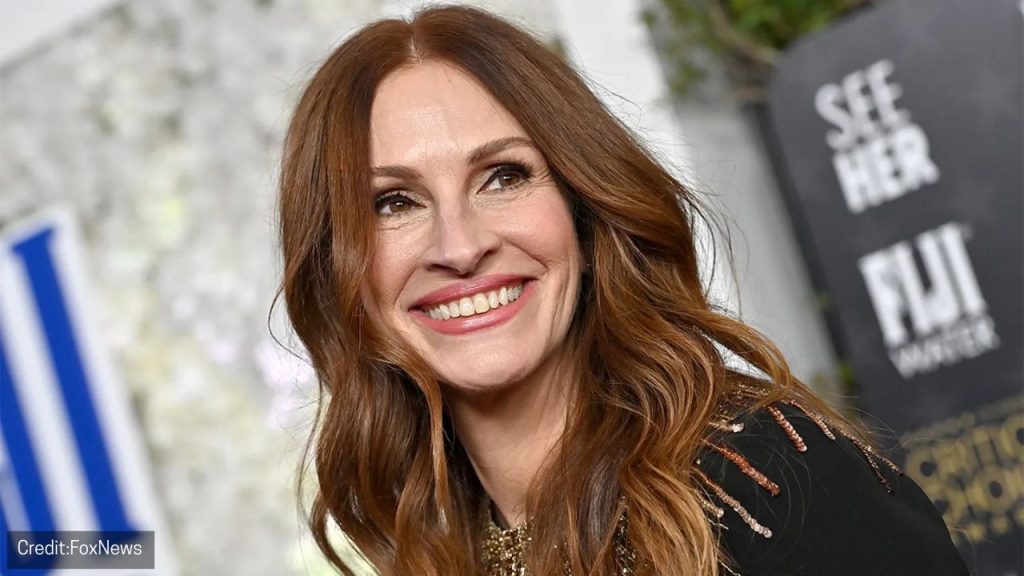 Director Luca Guadagnino and Julia Roberts promoting After the Hunt