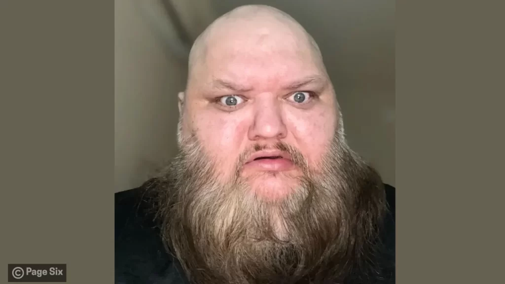 Close-up headshot of John Crawley showing his distinctive beard and expressive face — known for comedic reaction videos.