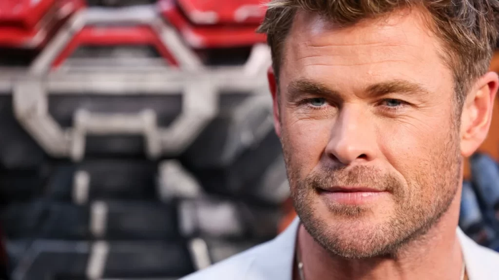 Actor Chris Hemsworth in a recent public appearance, smiling at cameras