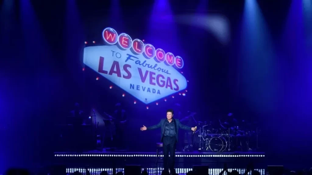 Donny Osmond smiling and interacting with the audience during his 2025 residency performance.