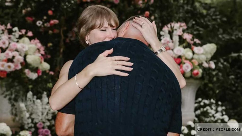 Travis Kelce hugs Taylor Swift in a garden right after proposing