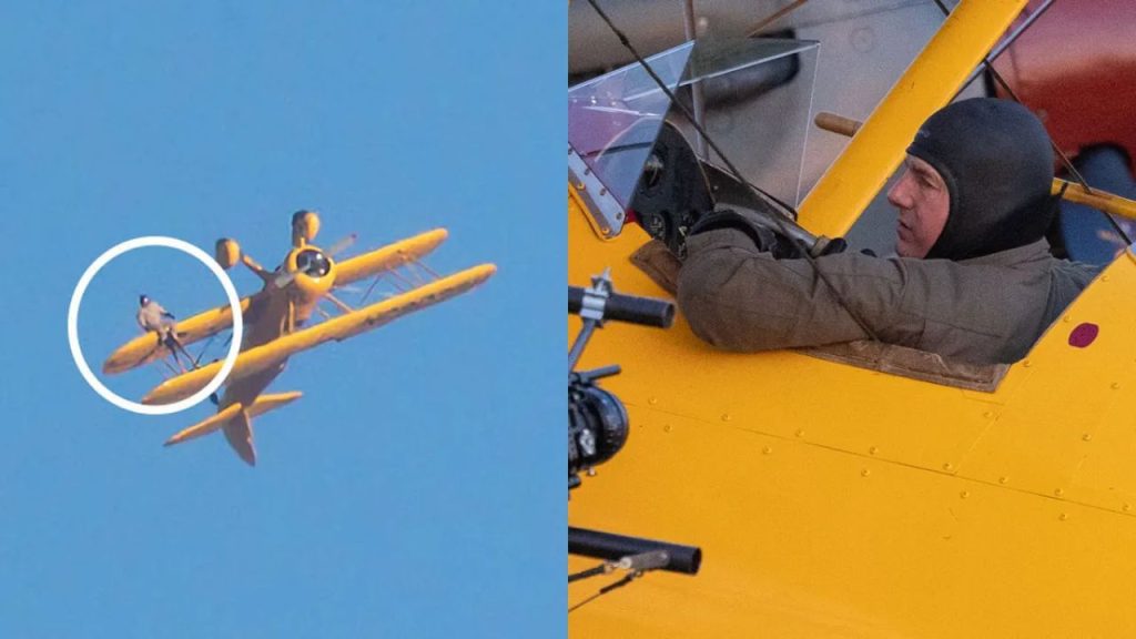 Tom Cruise clinging to the wing of a vintage biplane during Mission Impossible 8 stunt scene.
