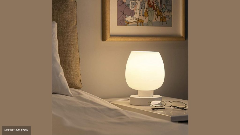 Elegant bedroom setup showcasing touch bedside table lamp with soft ambient glow.