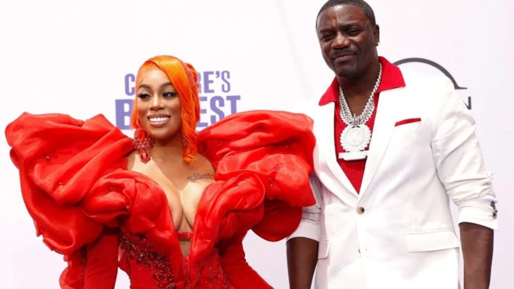 Akon and Tomeka Thiam at a public event.
