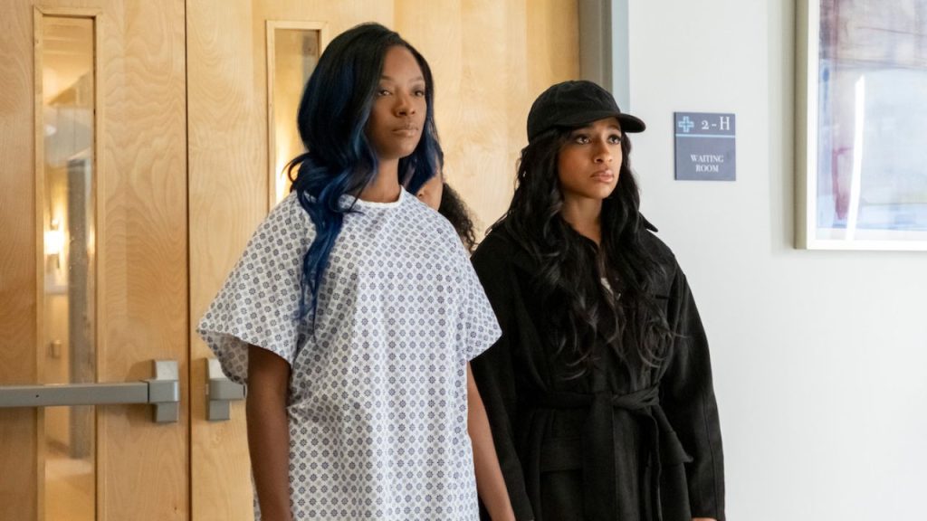Two female characters standing in a hospital hallway in Beauty in Black Season 2