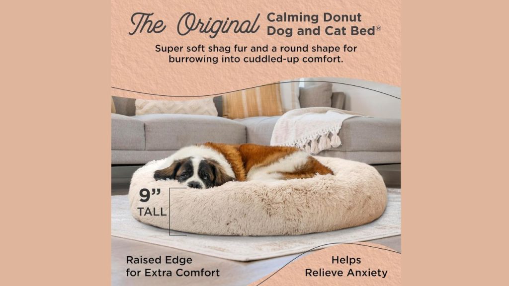 Dog sleeping peacefully in Sheri Calming Donut Dog Bed