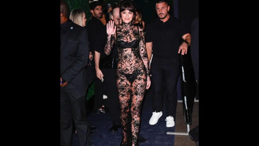 Dakota Johnson wore a black sheer dress to the Kering Foundation’s Care for Women Dinner