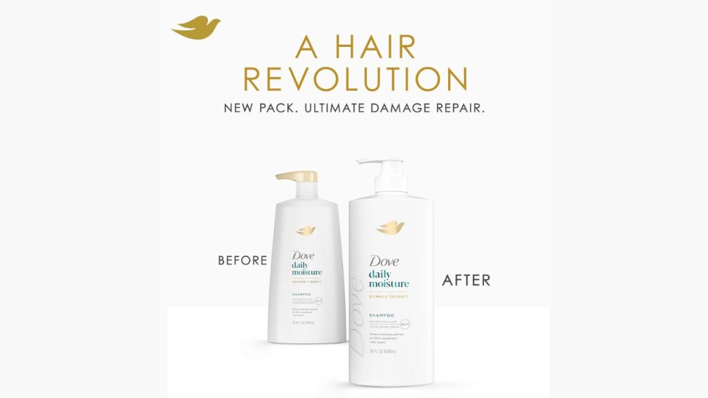 Woman holding Dove Damage Therapy Shampoo bottle