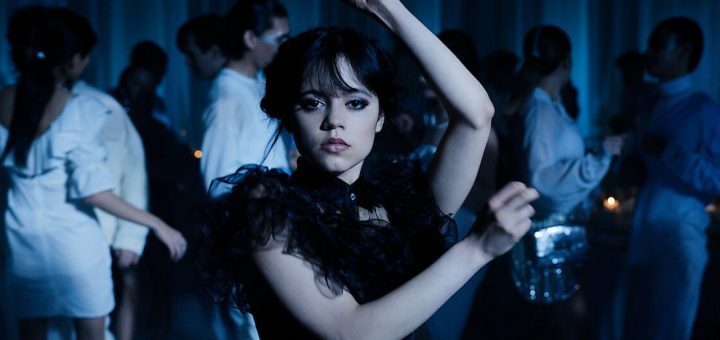 Jenna Ortega performing a gothic-style dance move as Wednesday Addams.