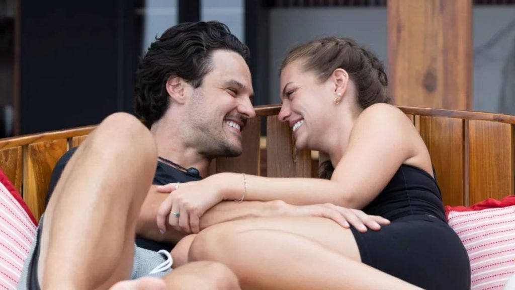 Jess Edwards and Spencer Conley share an affectionate moment, symbolizing their connection and strength as a couple.