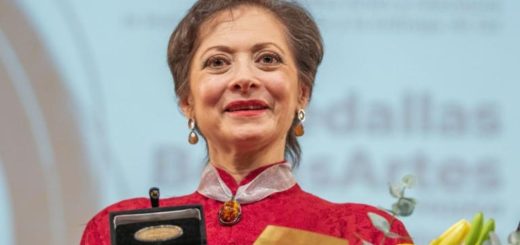 Portrait of Mexican soprano Lourdes Ambriz smiling in a formal outfit