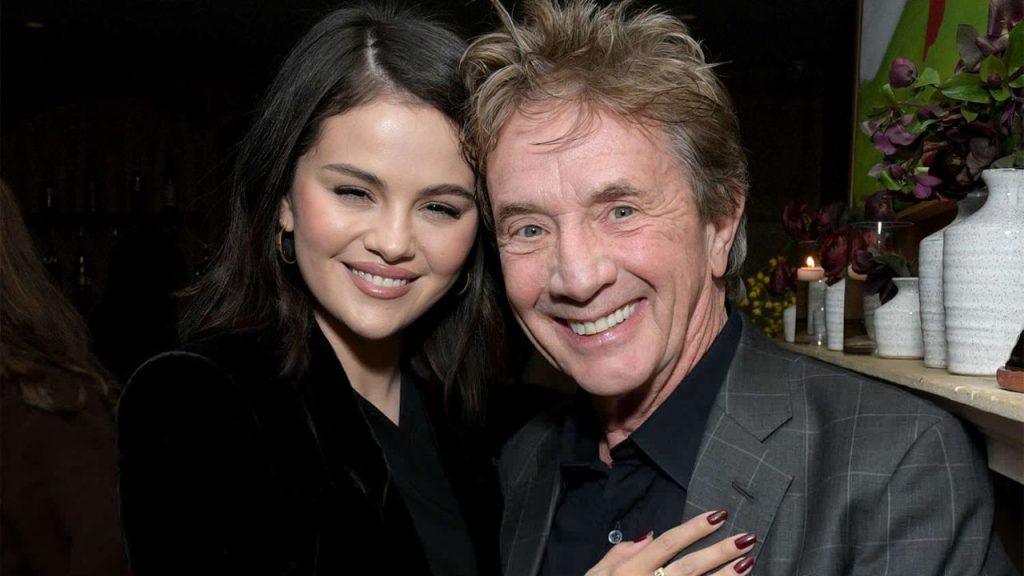Selena Gomez posing with Martin Short at a People event, celebrating her upcoming wedding.