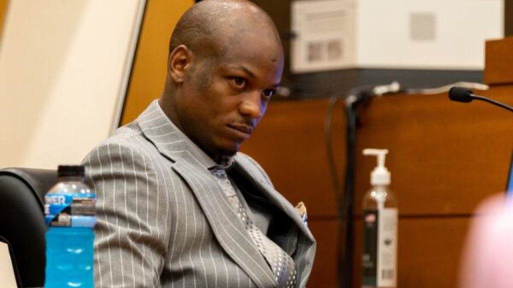 Close-up shot of YSL Woody looking tense during his testimony.