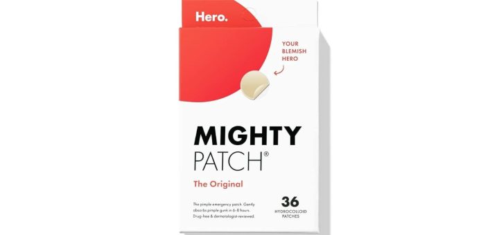Close-up of a clear Mighty Patch pimple patch on skin, showing the absorbed fluid turning the center white.