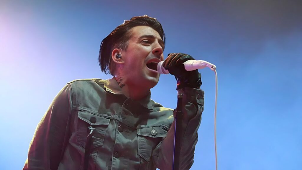 Ian Watkins performing on stage
