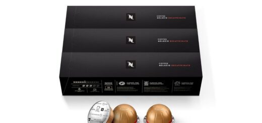 Nespresso Vertuo Melozio Decaffeinato coffee pod with a freshly brewed cup showing smooth crema.