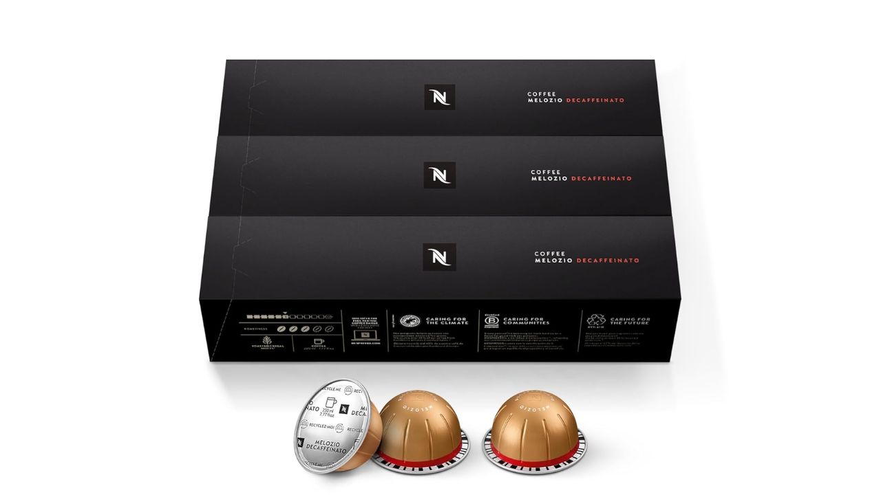 Nespresso Vertuo Melozio Decaffeinato coffee pod with a freshly brewed cup showing smooth crema.